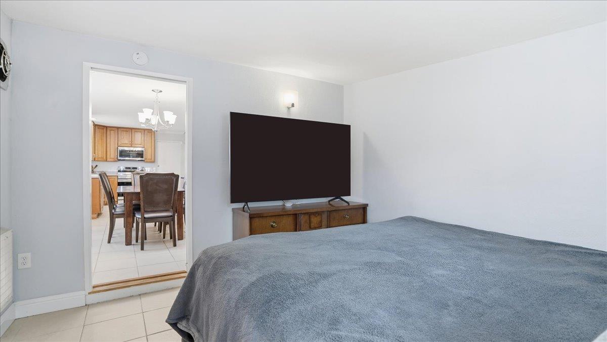5701 Chipping Way Citrus Heights, CA 95621 - Photo 20 of 41 a bedroom with a bed and a flat screen tv