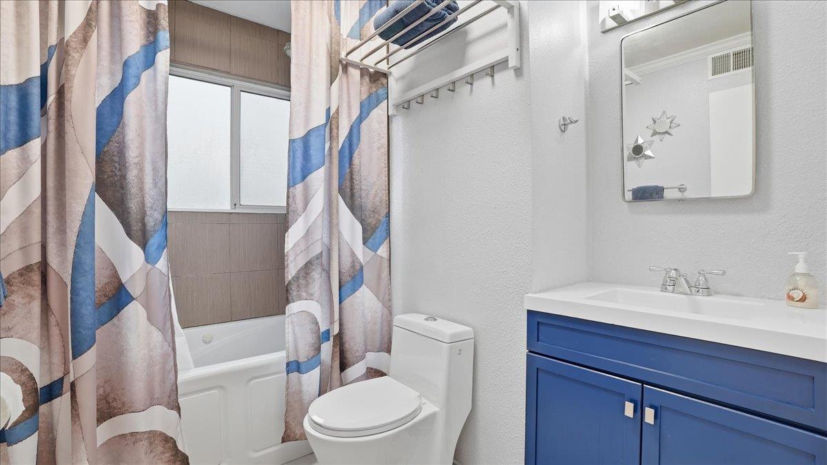 5701 Chipping Way Citrus Heights, CA 95621 - Photo 23 of 41 a white toilet sitting next to a bathroom sink
