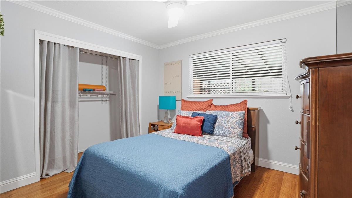 5701 Chipping Way Citrus Heights, CA 95621 - Photo 24 of 41 a bedroom with bed and wooden floor