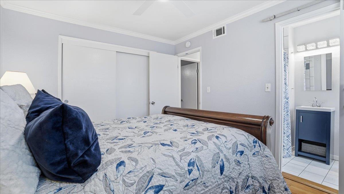 5701 Chipping Way Citrus Heights, CA 95621 - Photo 26 of 41 a bedroom with a bed and a lamp on dresser