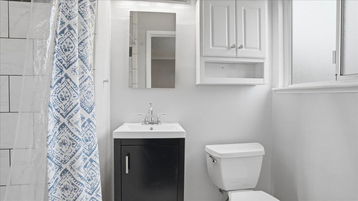5701 Chipping Way Citrus Heights, CA 95621 - Photo 29 of 41 a bathroom with a toilet sink and mirror