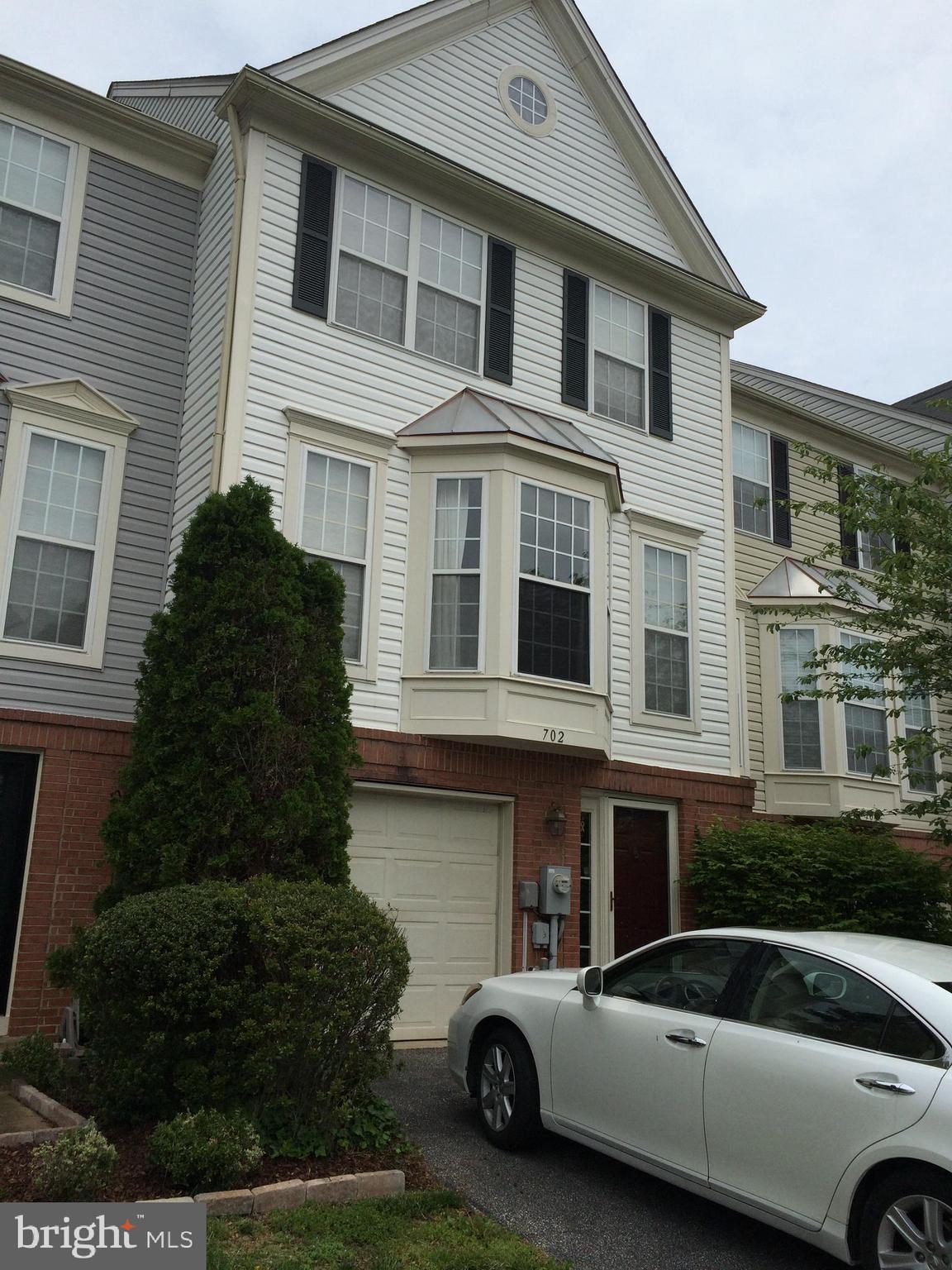 702 Howards Loop Annapolis, MD 21401 - Photo 1 of 54 a car parked in front of a house