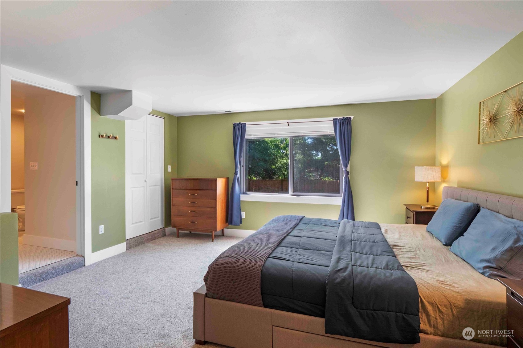 8845 24th Avenue Southwest Seattle, WA 98106 - Photo 12 of 22 a bedroom with a bed and large window