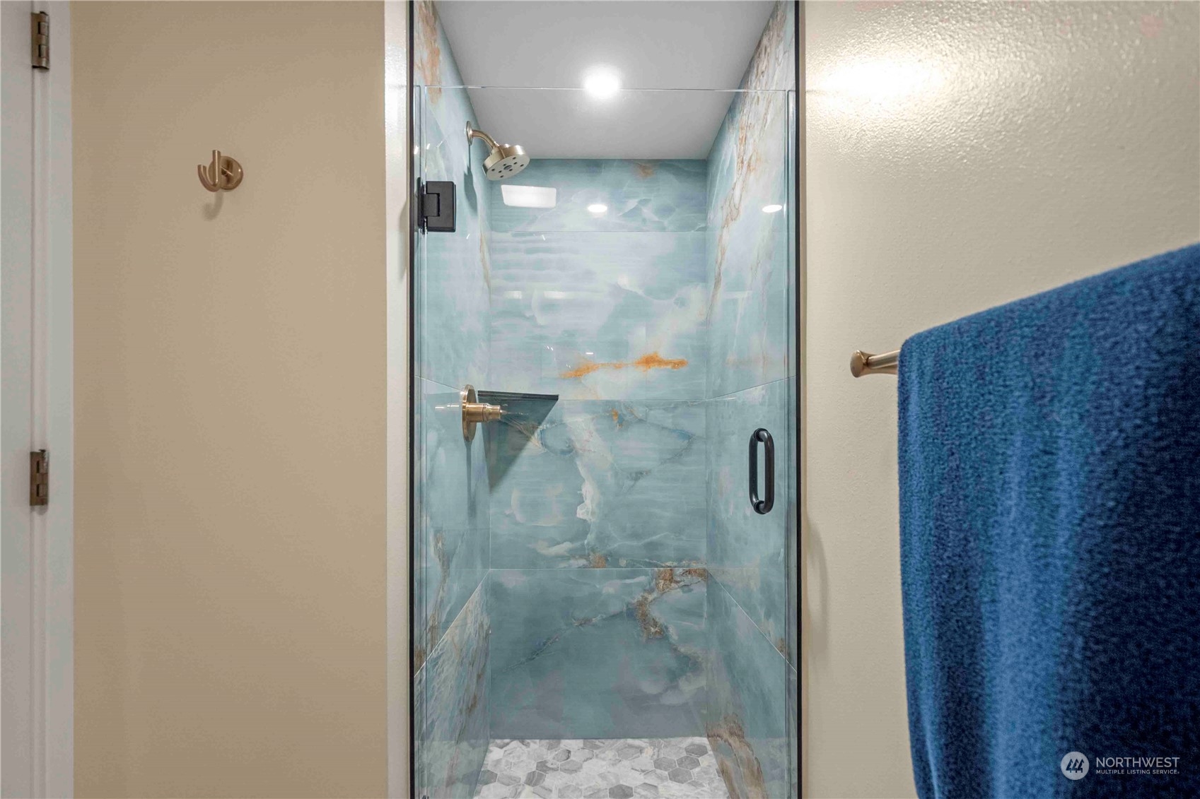8845 24th Avenue Southwest Seattle, WA 98106 - Photo 17 of 22 a bathroom with a glass shower door