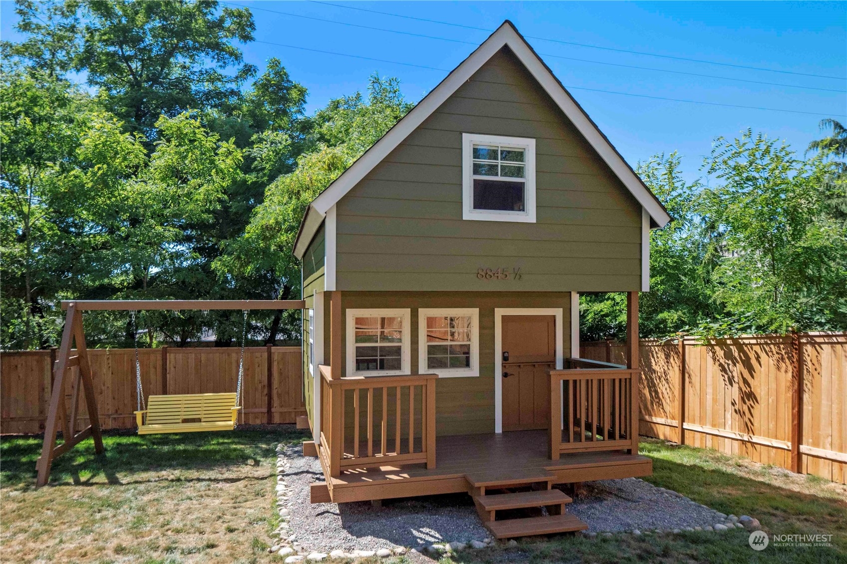 8845 24th Avenue Southwest Seattle, WA 98106 - Photo 19 of 22 a front view of a house with a yard