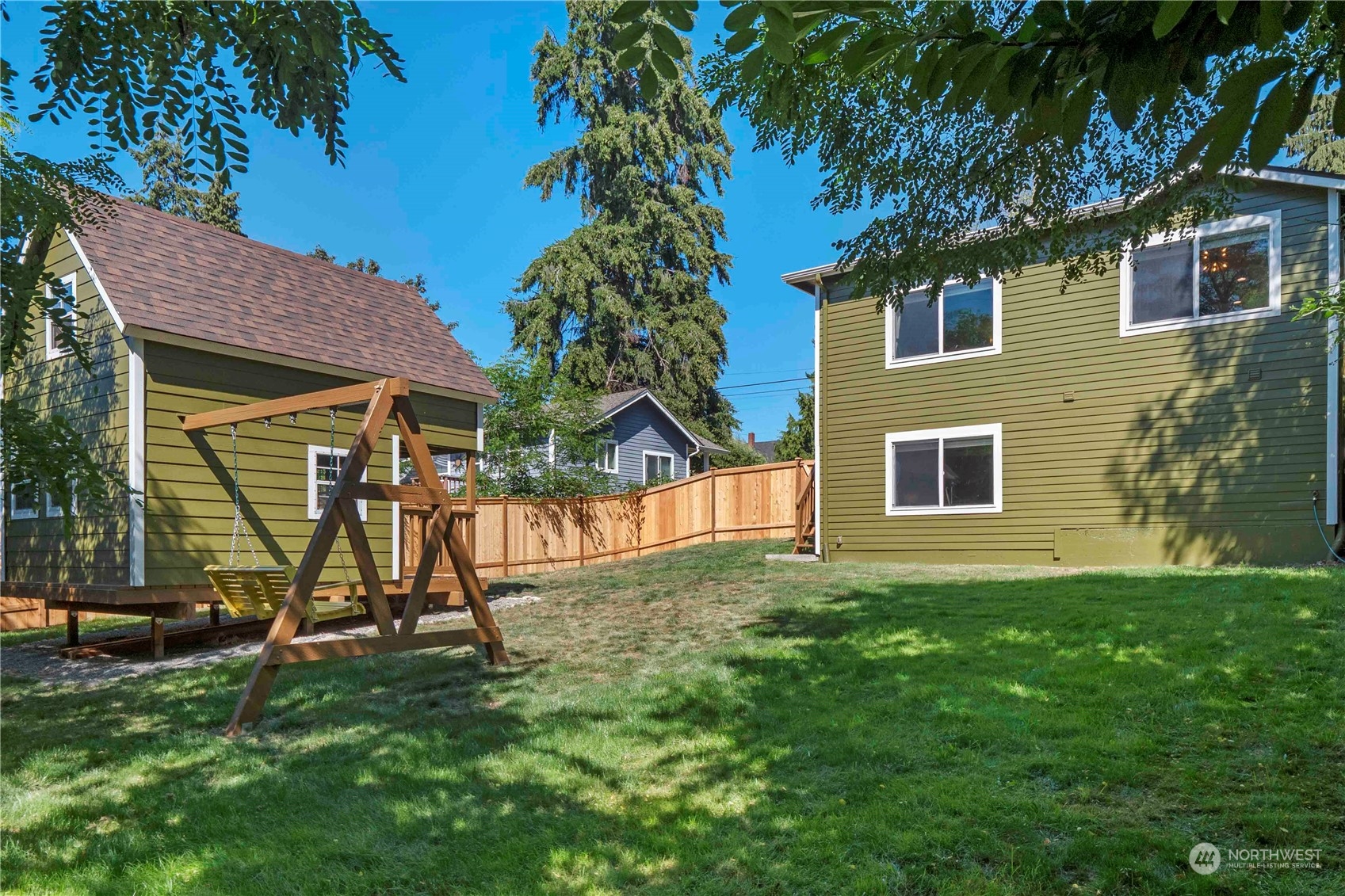8845 24th Avenue Southwest Seattle, WA 98106 - Photo 21 of 22 a view of a house with a backyard