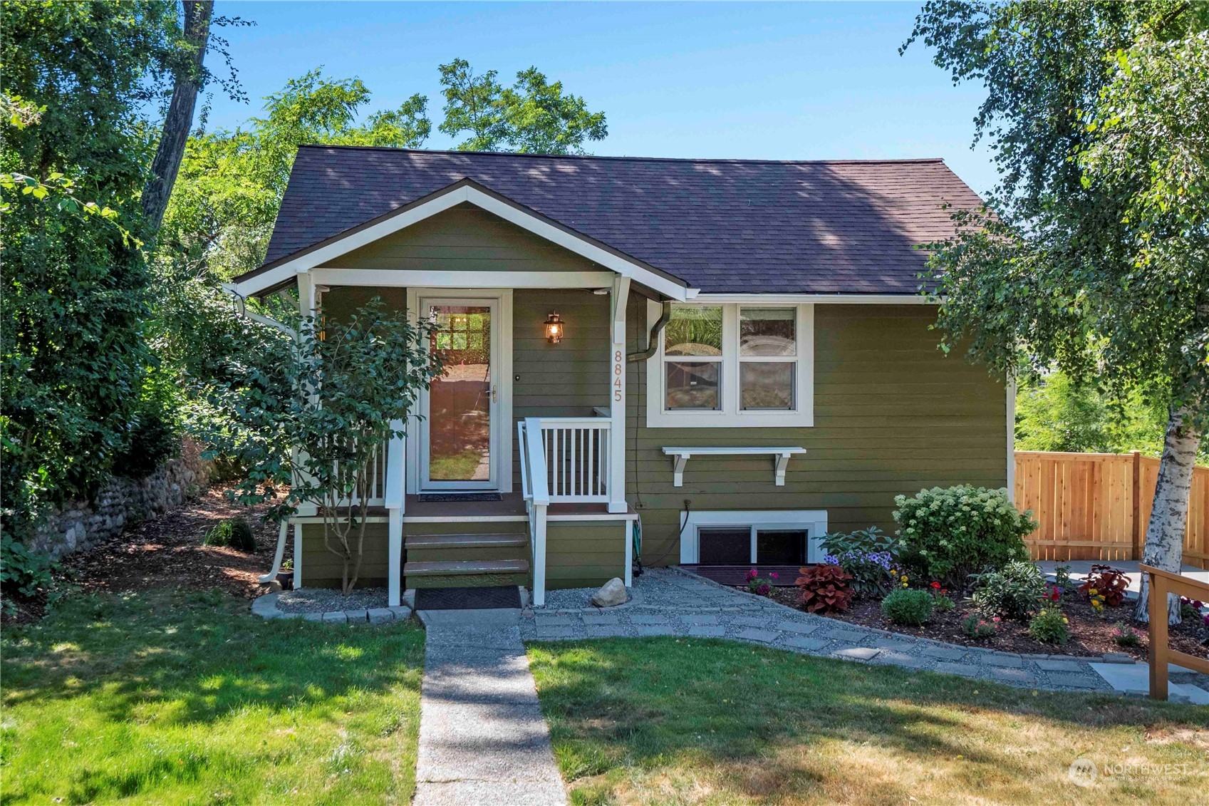 8845 24th Avenue Southwest Seattle, WA 98106 - Photo 22 of 22 a front view of a house with a yard