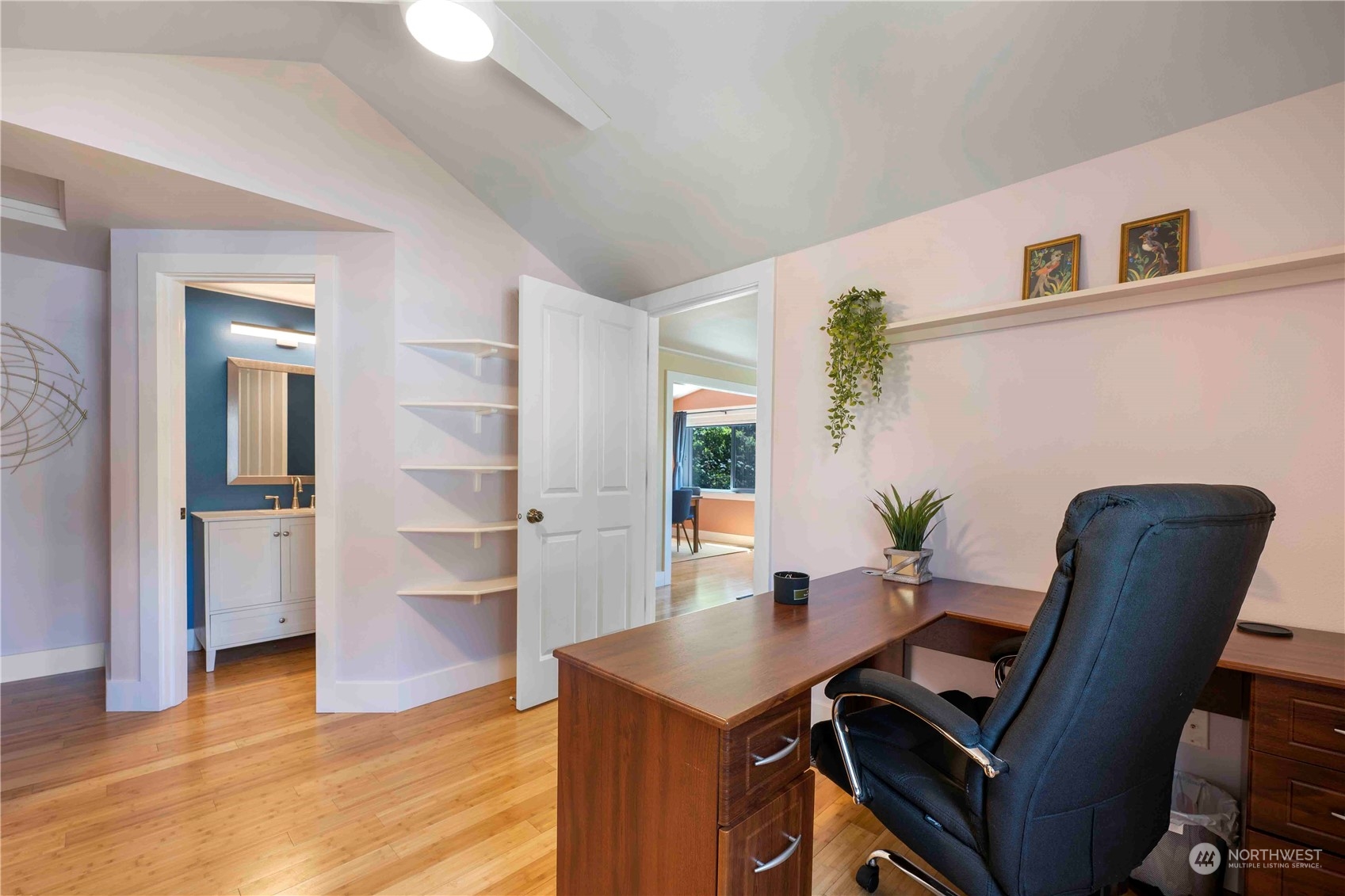 8845 24th Avenue Southwest Seattle, WA 98106 - Photo 8 of 22 a view of a workspace with furniture and wooden floor