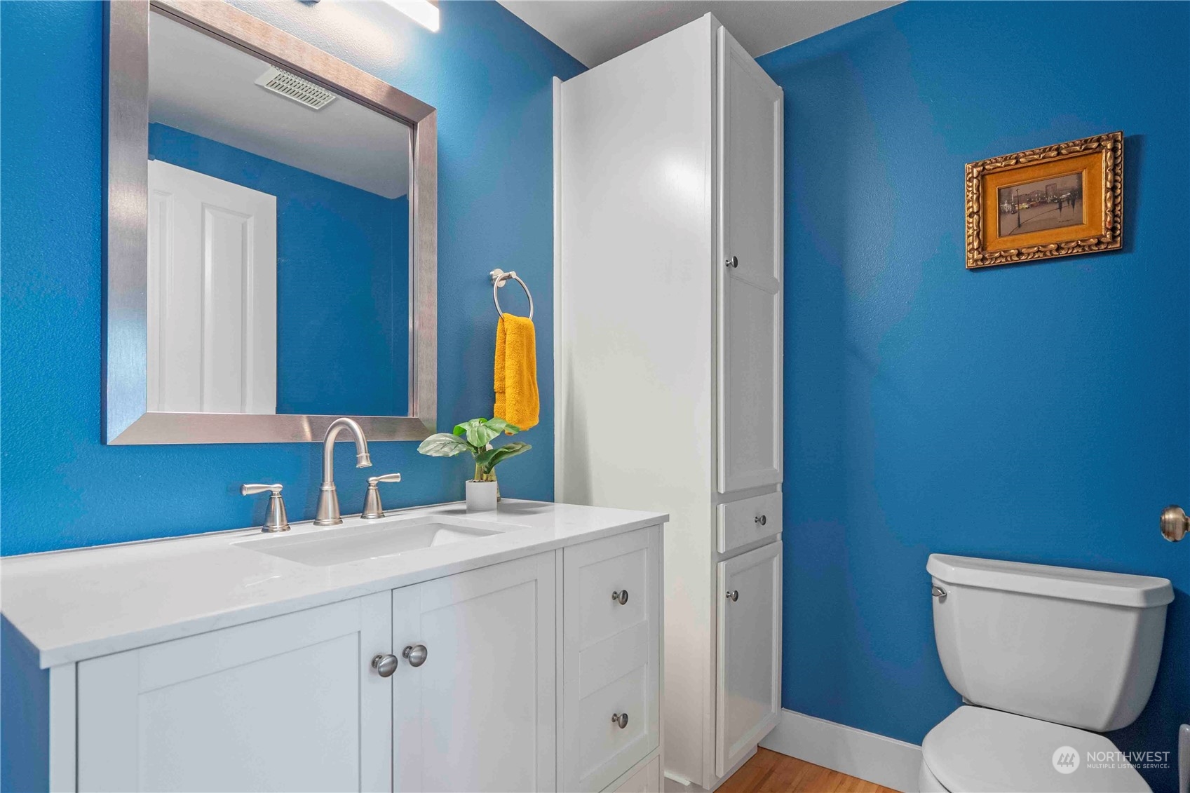 8845 24th Avenue Southwest Seattle, WA 98106 - Photo 9 of 22 a bathroom with a toilet sink and mirror