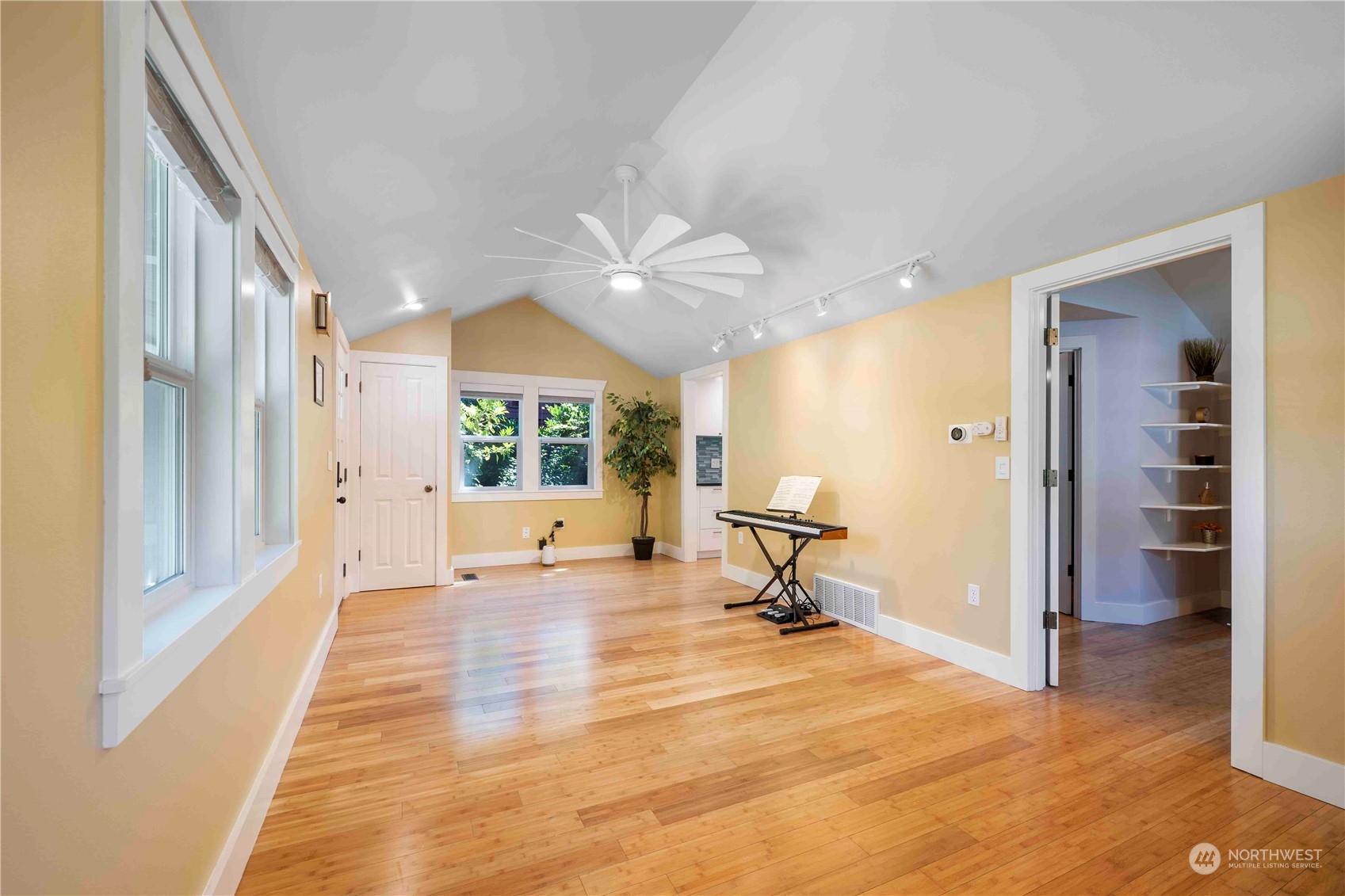 8845 24th Avenue Southwest Seattle, WA 98106 - Photo 10 of 22 a view of a room with a window and wooden floor