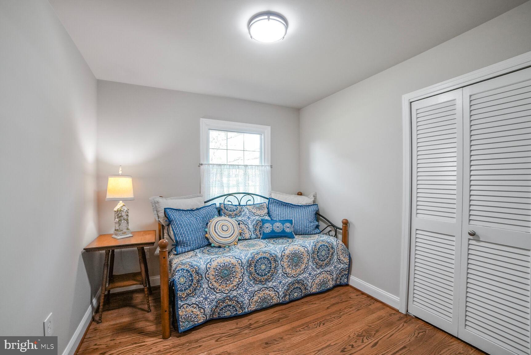 7549 Cherry Tree Drive Fulton, MD 20759 - Photo 32 of 64 a bedroom with a bed and wooden floor