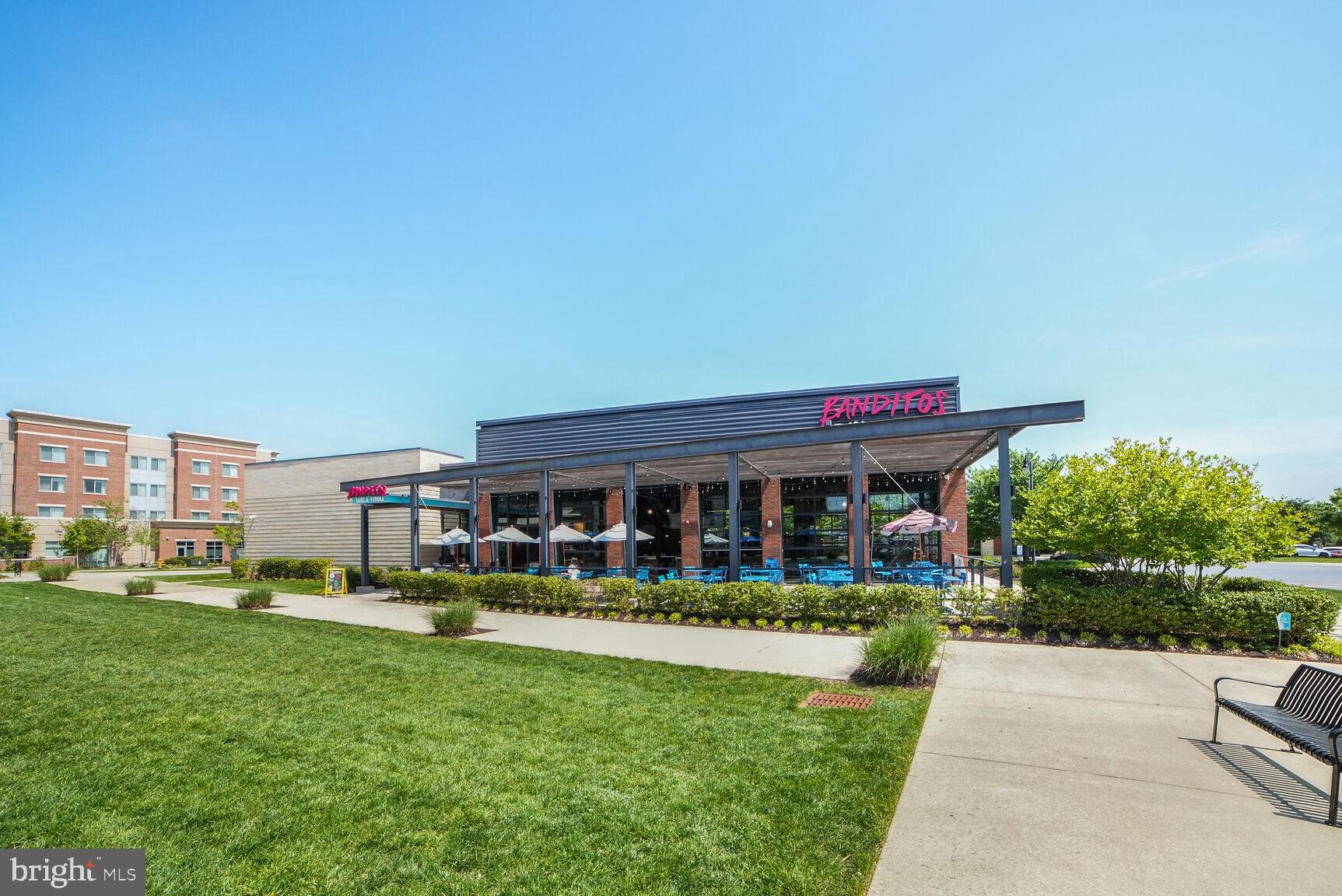 7549 Cherry Tree Drive Fulton, MD 20759 - Photo 63 of 64 a front view of a house with a yard table and chairs