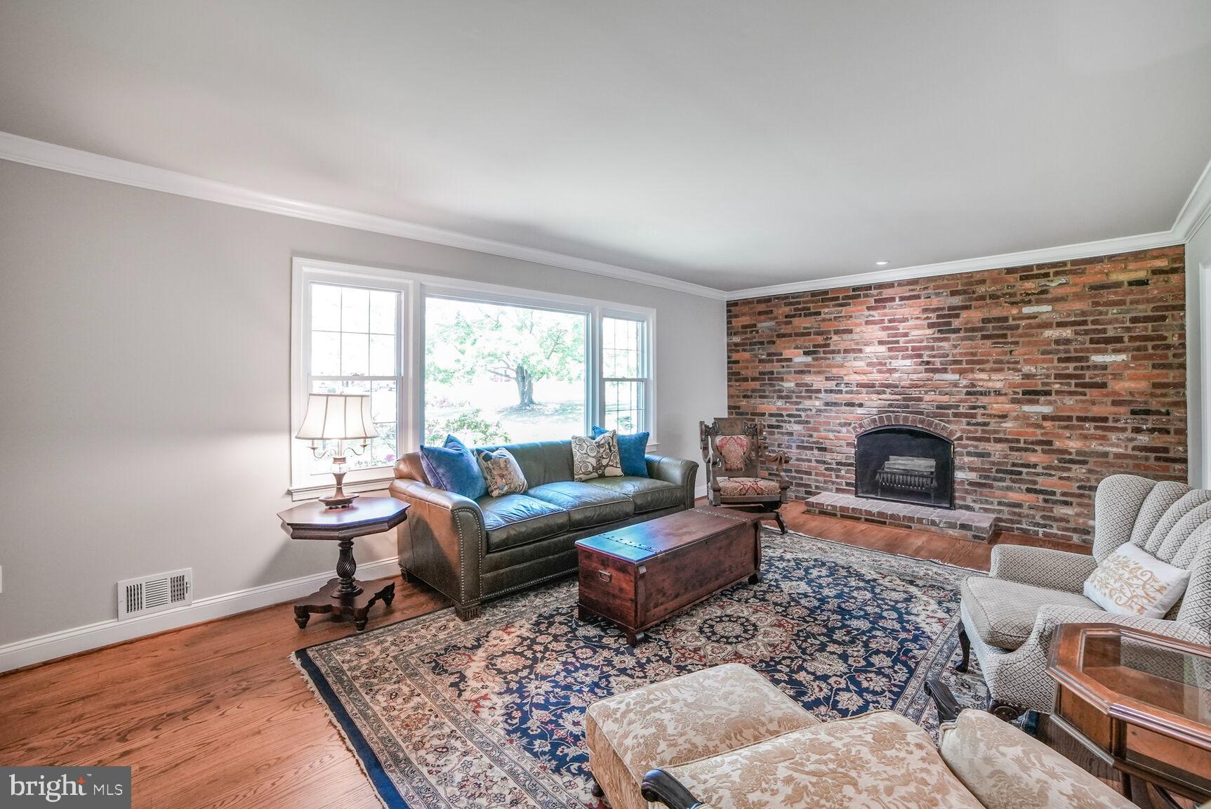 7549 Cherry Tree Drive Fulton, MD 20759 - Photo 10 of 64 a living room with furniture and a fireplace