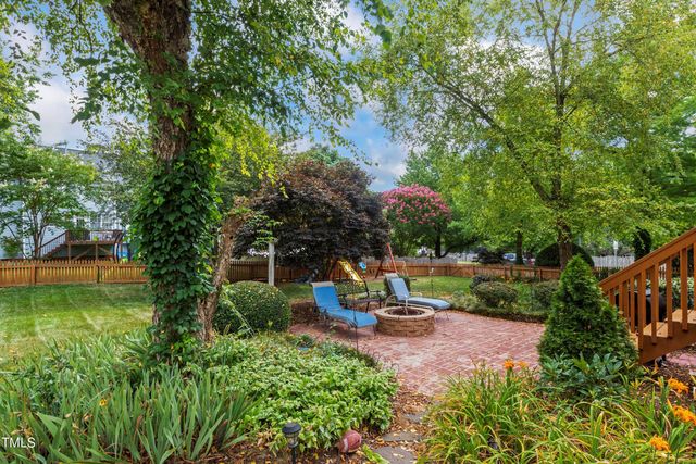 a view of a park with plants and a bench