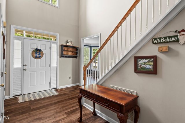 a view of staircase with wooden floor and stairs