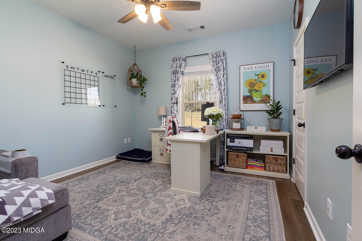 150 Homestead Circle Forsyth, GA 31029 - Photo 17 of 30 a room with furniture and a window