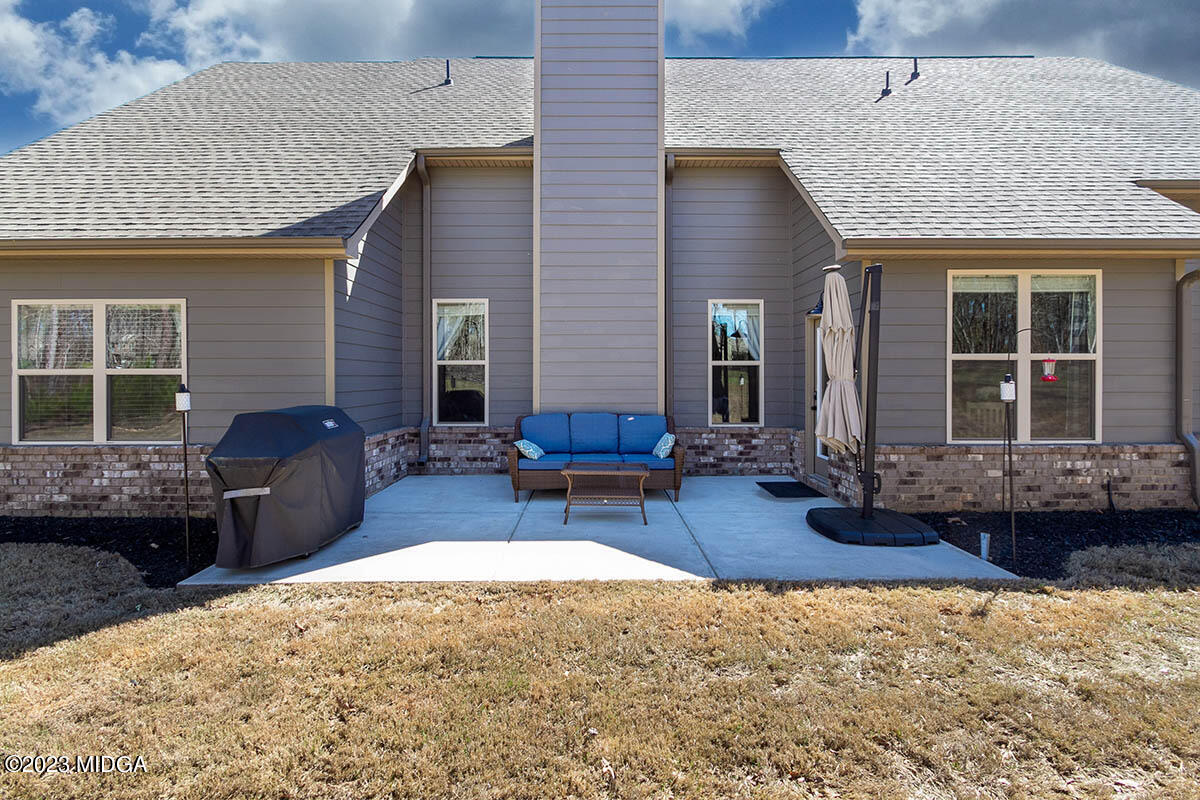 150 Homestead Circle Forsyth, GA 31029 - Photo 28 of 30 a view of a house with patio