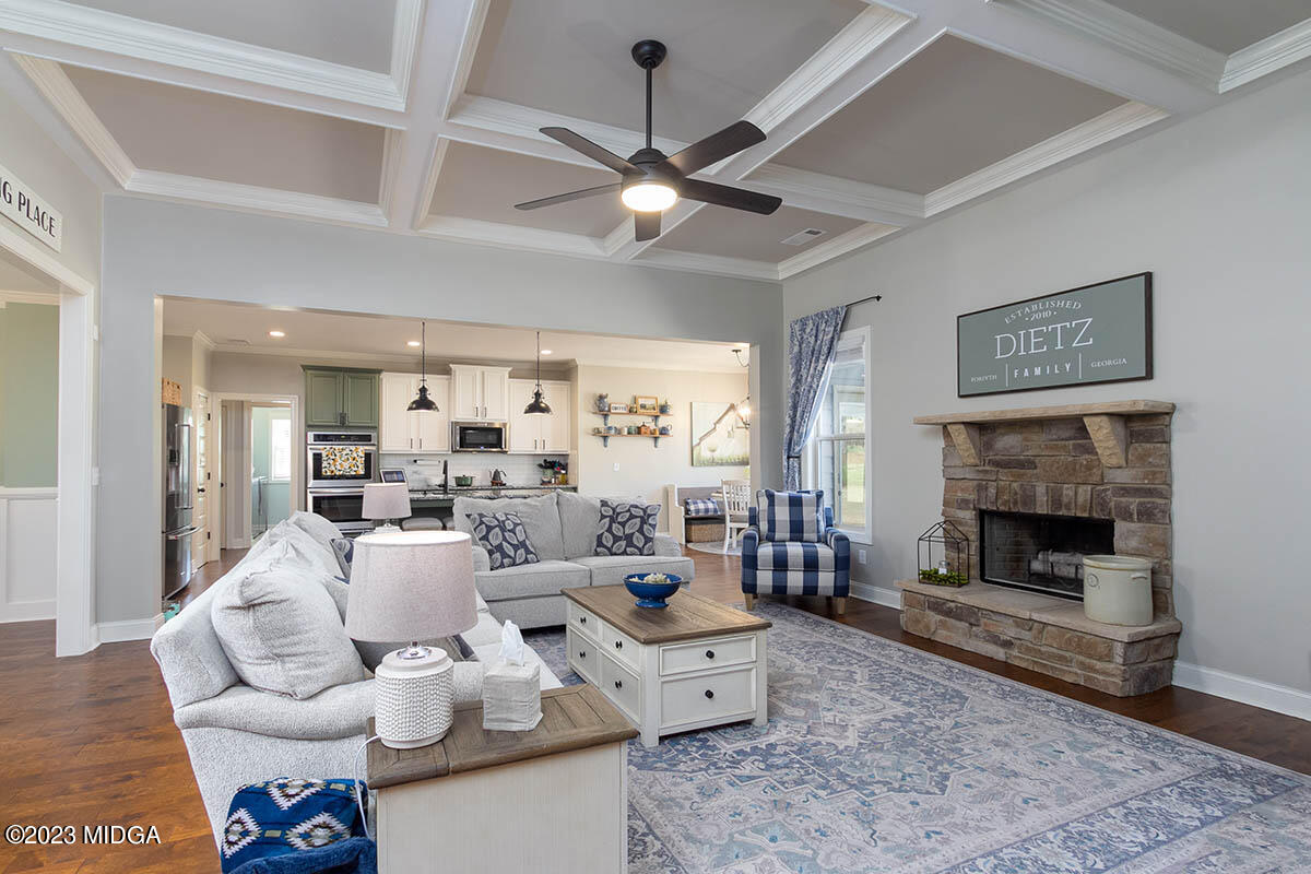 150 Homestead Circle Forsyth, GA 31029 - Photo 10 of 30 a living room with furniture and a fireplace