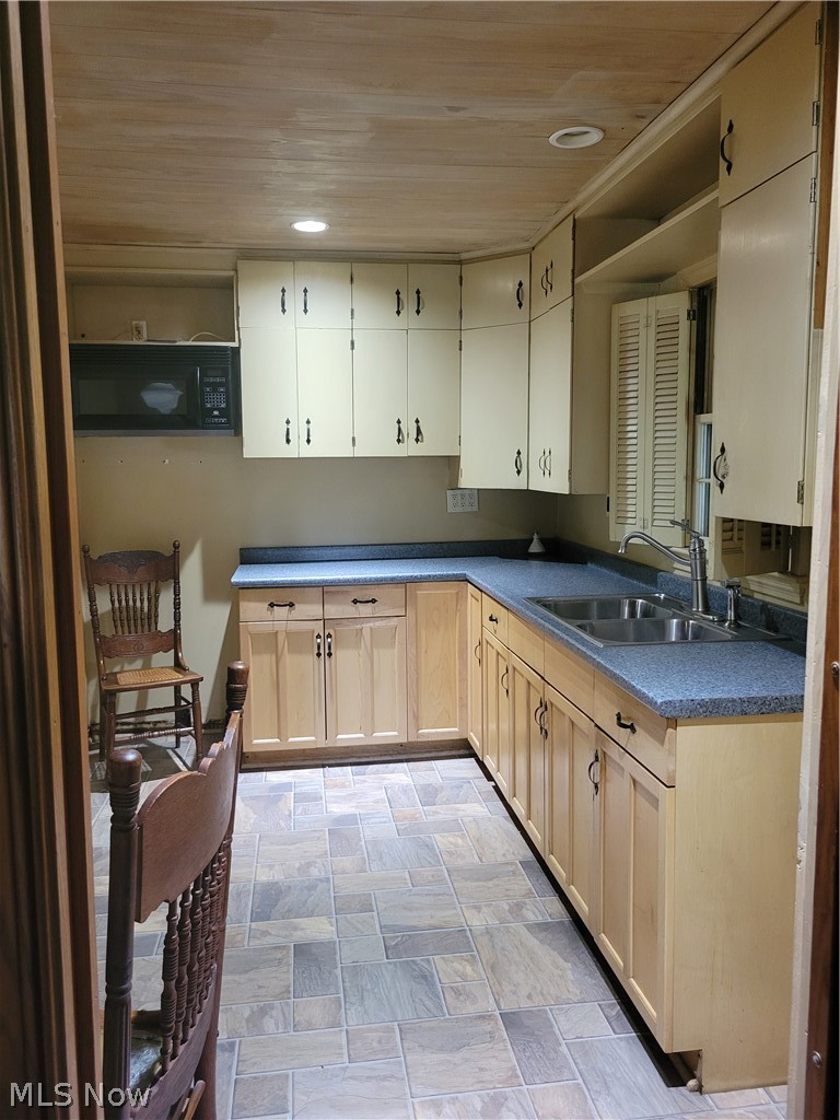 7357 Westview Road Kent, OH 44240 - Photo 14 of 30 Kitchen featuring light tile patterned floors, sink, and wooden ceiling