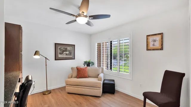 a living room with furniture and a window