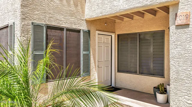 a view of a house with a door and wooden floor