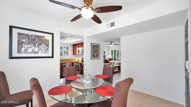 a dining room with furniture and window