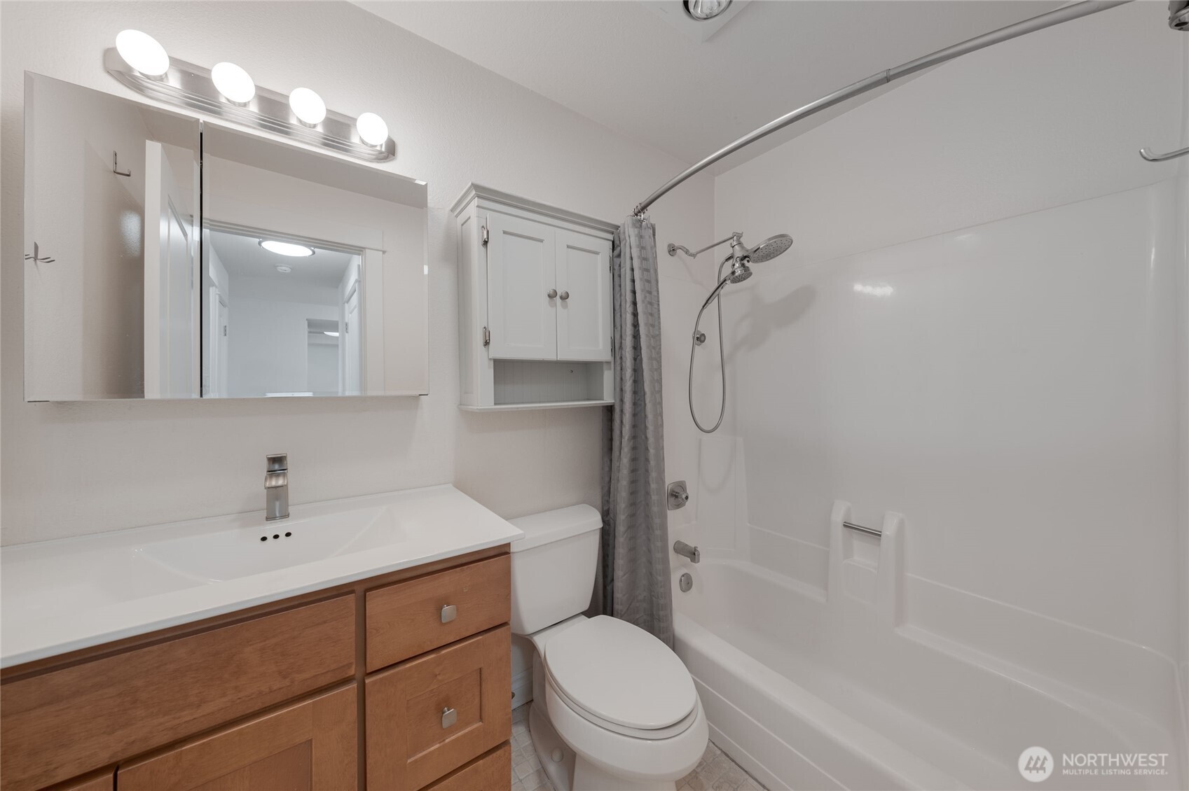 6055 35th Avenue Southwest, Unit 308 Seattle, WA 98126 - Photo 14 of 39 a bathroom with a sink a toilet and shower
