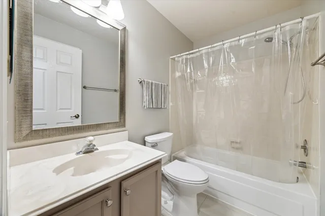 a bathroom with a sink a toilet and a bathtub