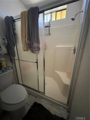 a room with furniture and view kitchen