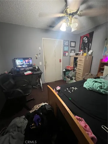 a bed sitting in a room next to a window