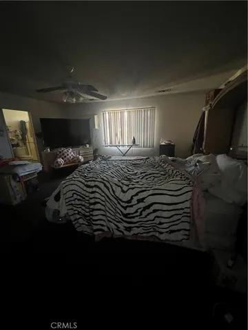 a living room with furniture and a lamp