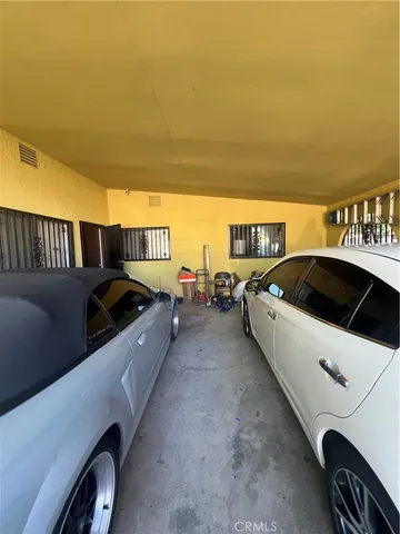 a view of a backyard with table and chairs
