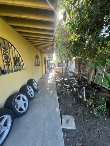 a view of a yard with snow on the road