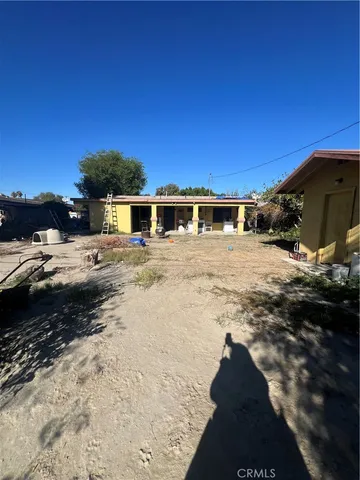 a view of a living room and kitchen