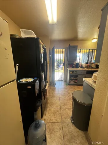 a dinning room with furniture and a flat screen tv