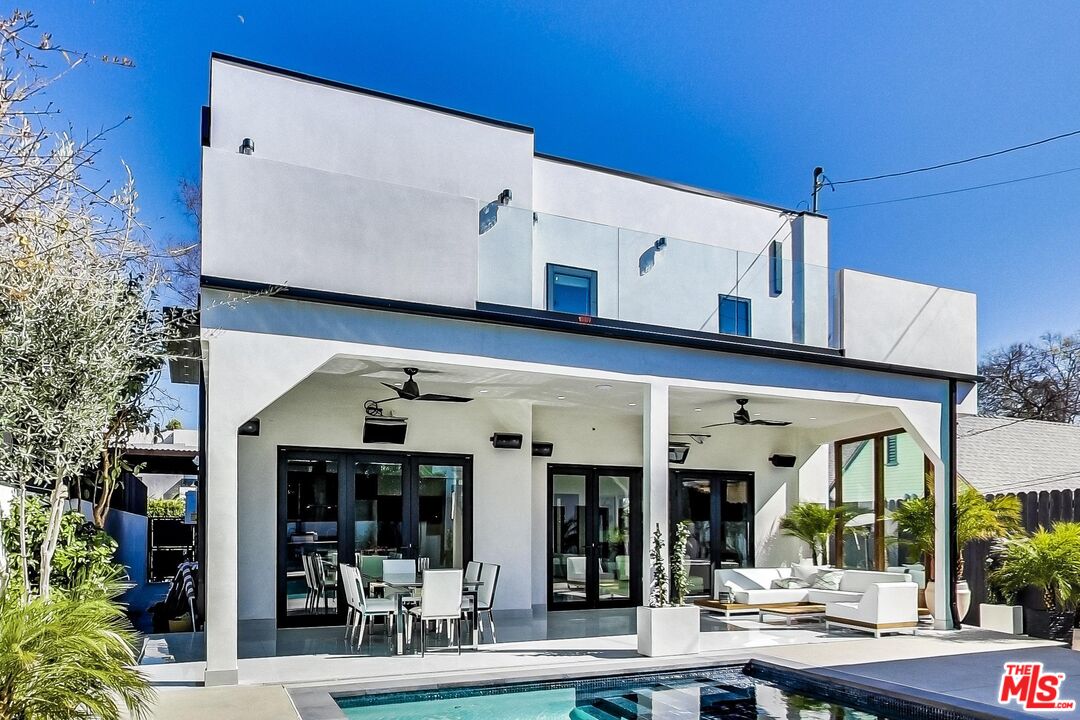 a view of a store with a outdoor seating
