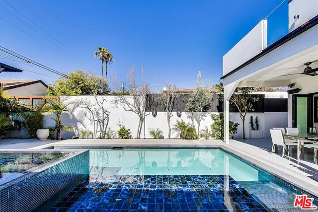 a view of a balcony with potted plants