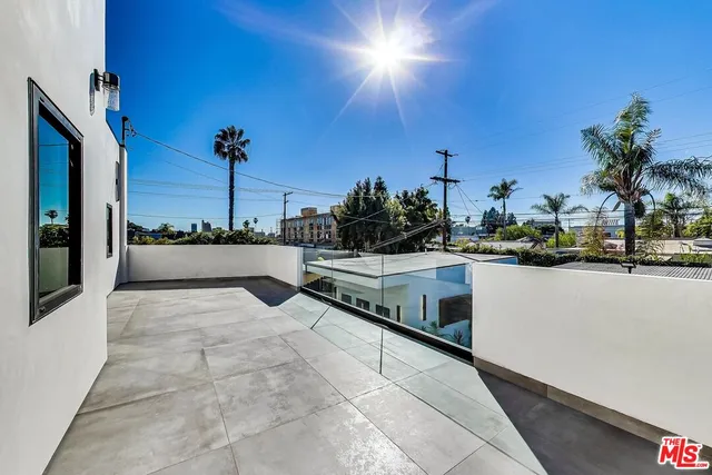 a en suite bathroom with a tub and potted plants