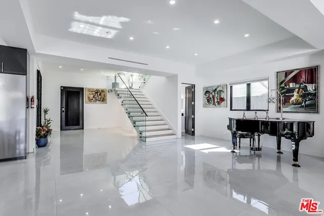 a dining room with furniture and entryway
