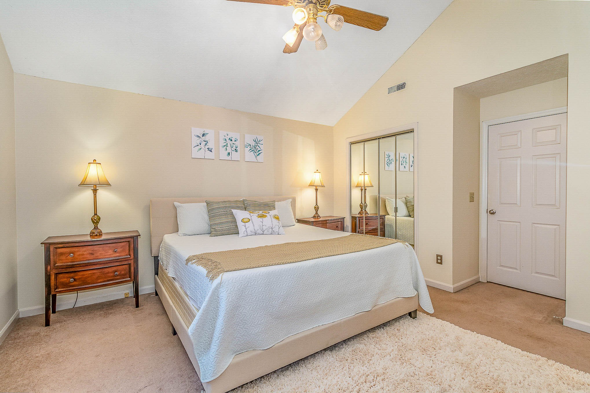 2445 Ravine Drive Nashville, TN 37217 - Photo 14 of 26 a spacious bedroom with a bed and a chandelier