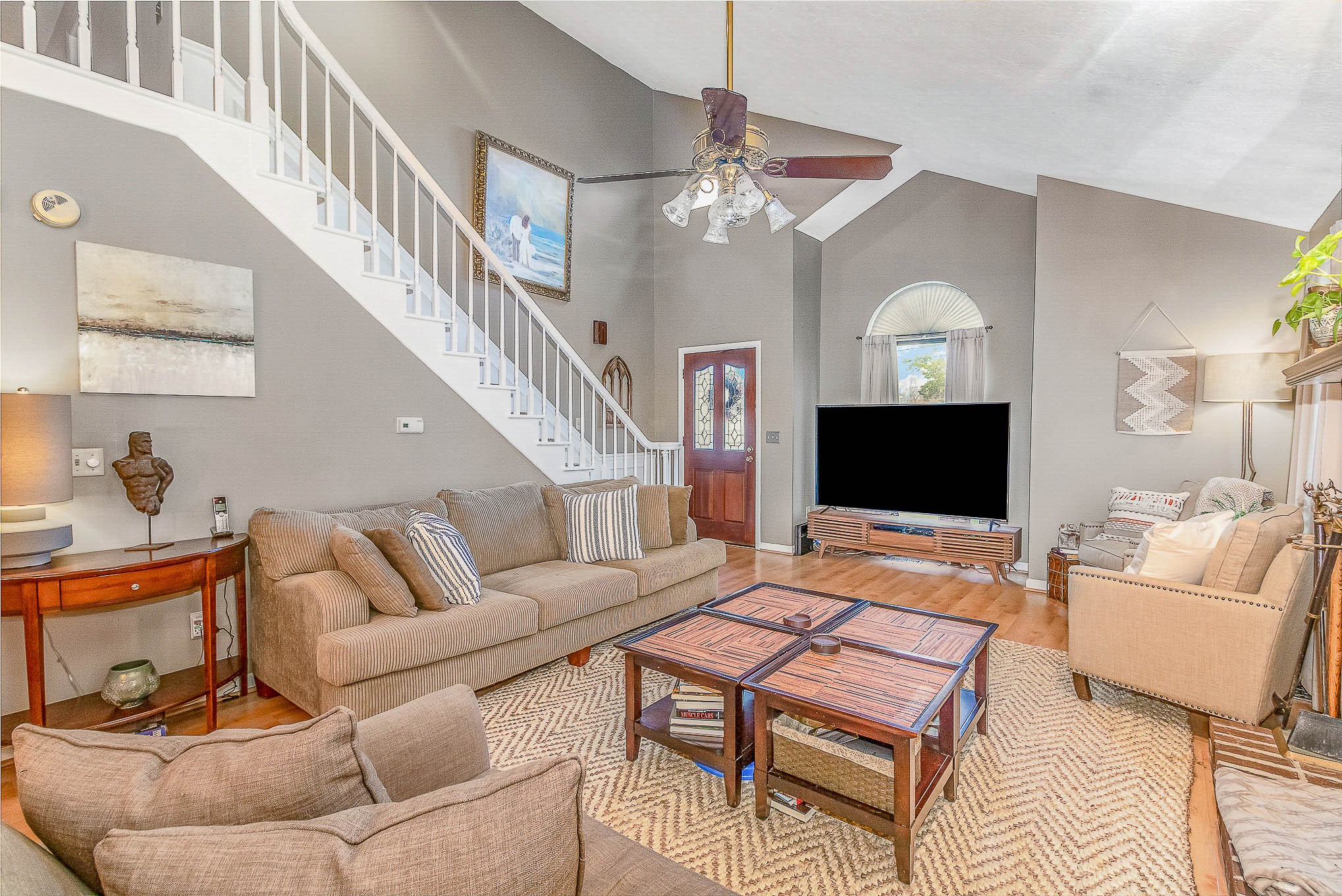 2445 Ravine Drive Nashville, TN 37217 - Photo 3 of 26 a living room with furniture a flat screen tv and a chandelier