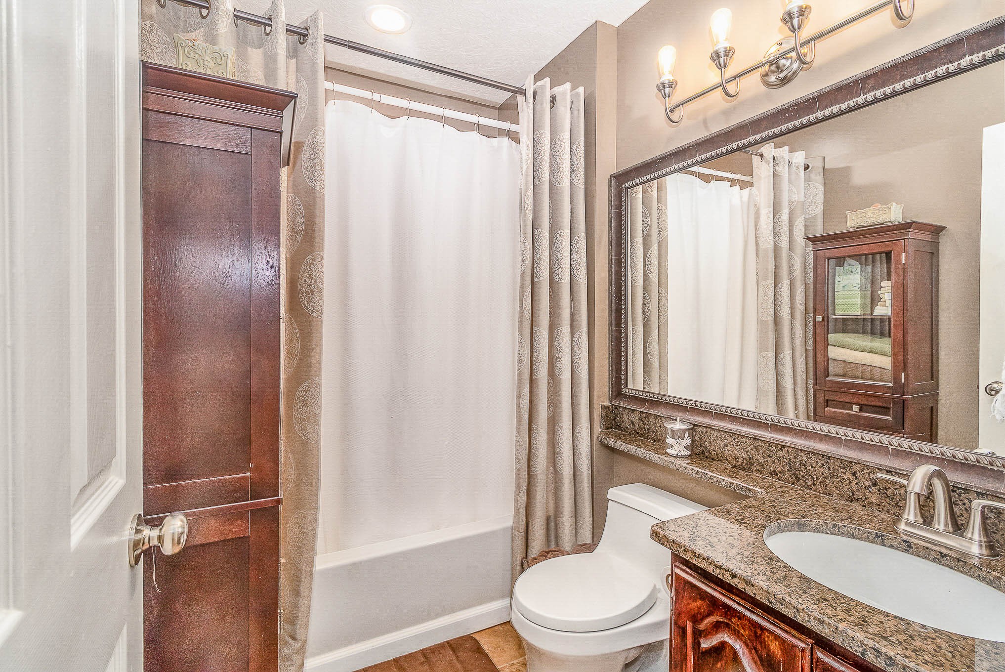 2445 Ravine Drive Nashville, TN 37217 - Photo 22 of 26 a bathroom with a granite countertop sink toilet and shower