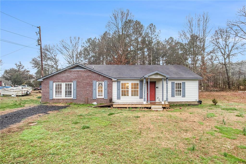 423 Tom Jones Road Kingston, GA 30145 - Photo 1 of 1 a front view of a house with a yard