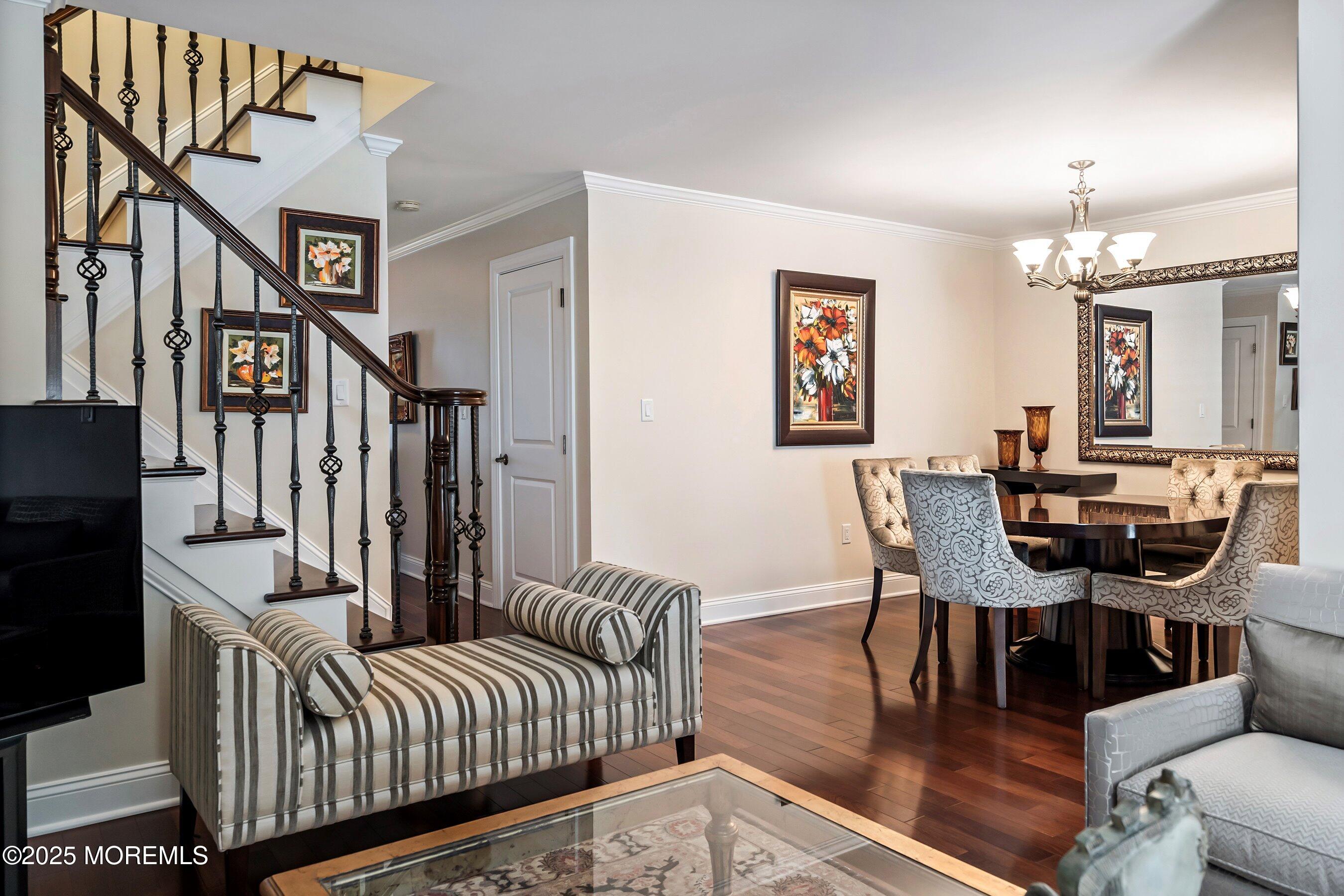32 Bristel Road, Unit 212 Holmdel, NJ 07733 - Photo 16 of 61 a living room with furniture and a dining table