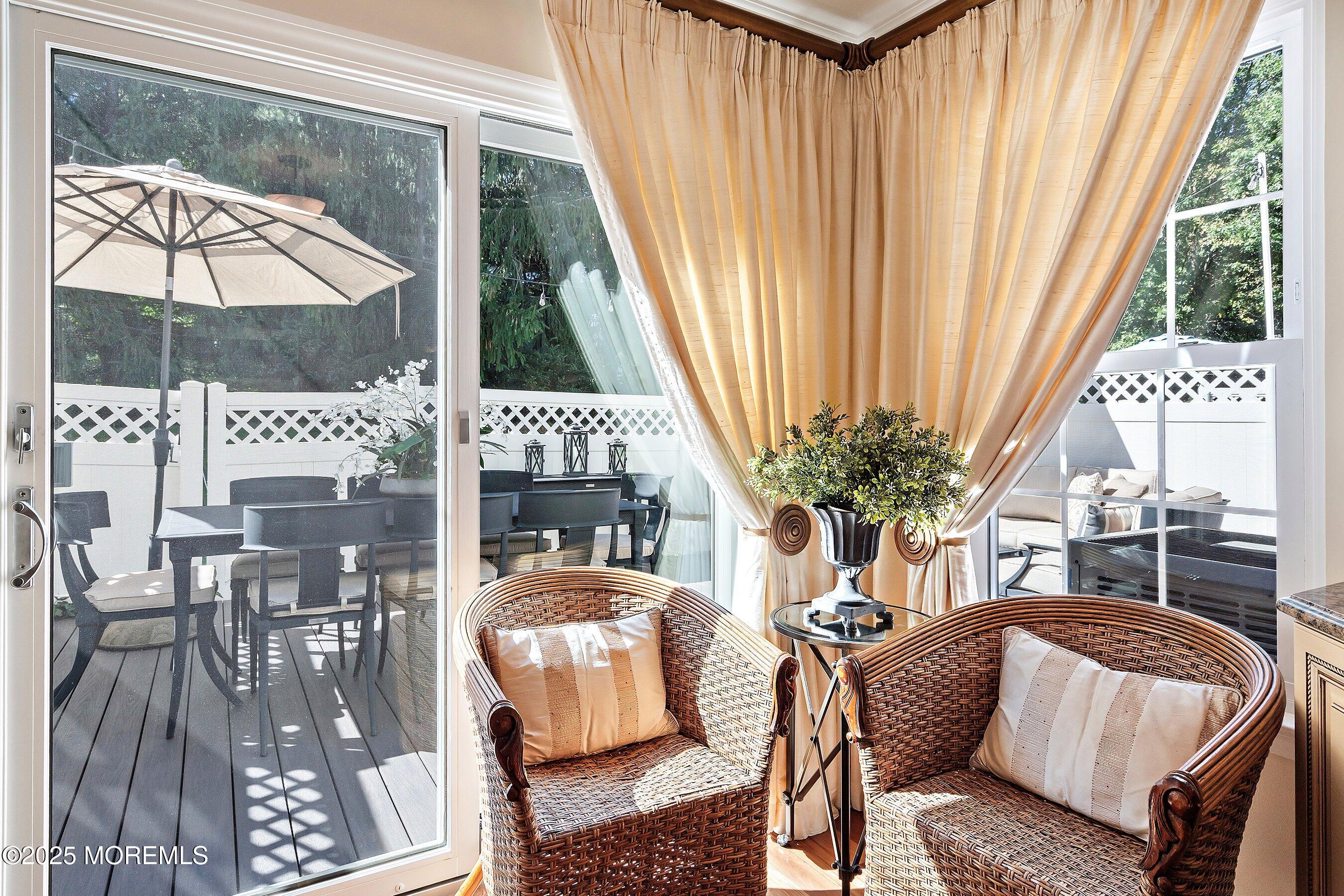 32 Bristel Road, Unit 212 Holmdel, NJ 07733 - Photo 20 of 61 a living room with furniture a fireplace and a floor to ceiling window