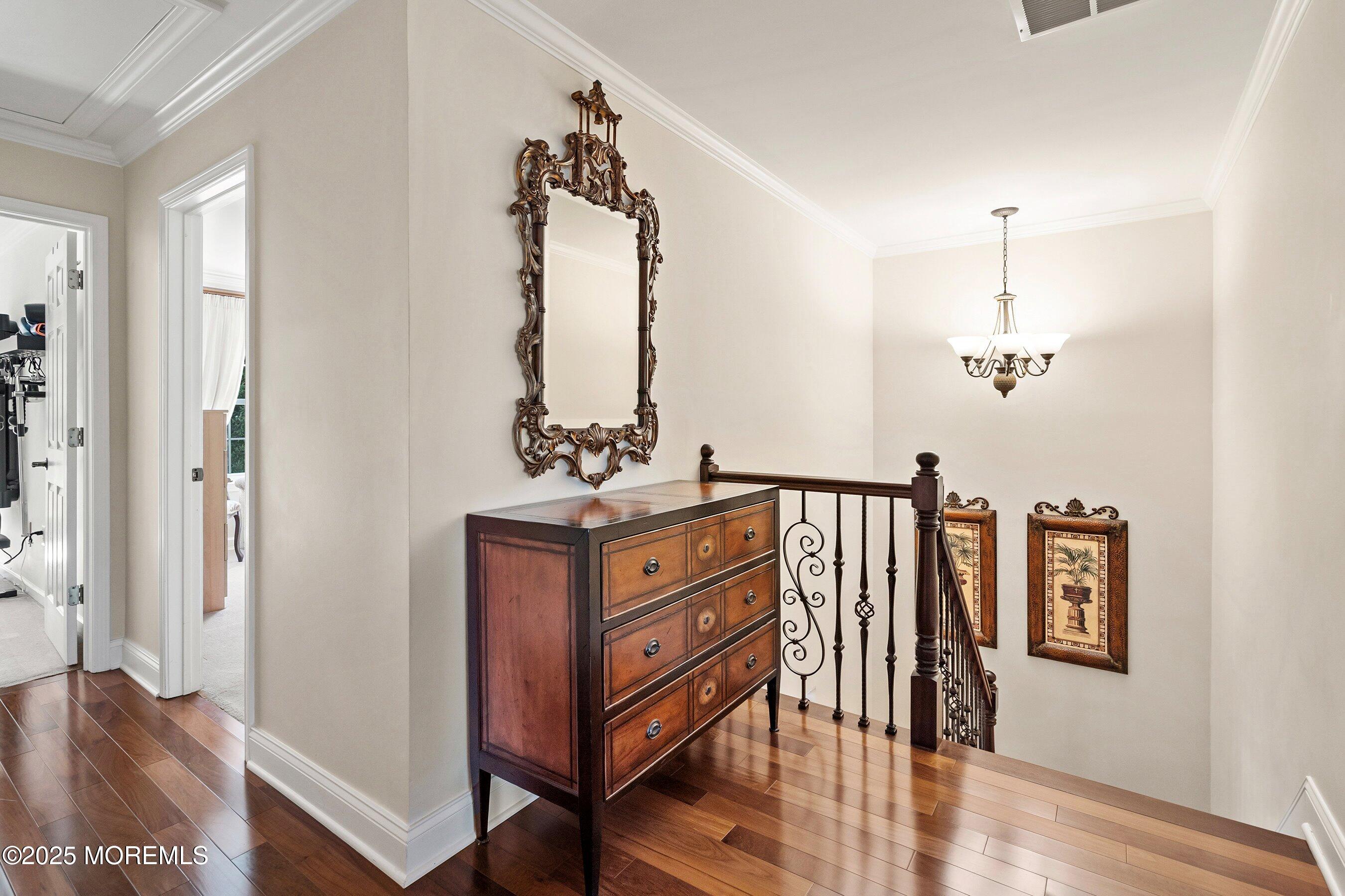 32 Bristel Road, Unit 212 Holmdel, NJ 07733 - Photo 24 of 61 a view of a hallway with wooden floor and windows