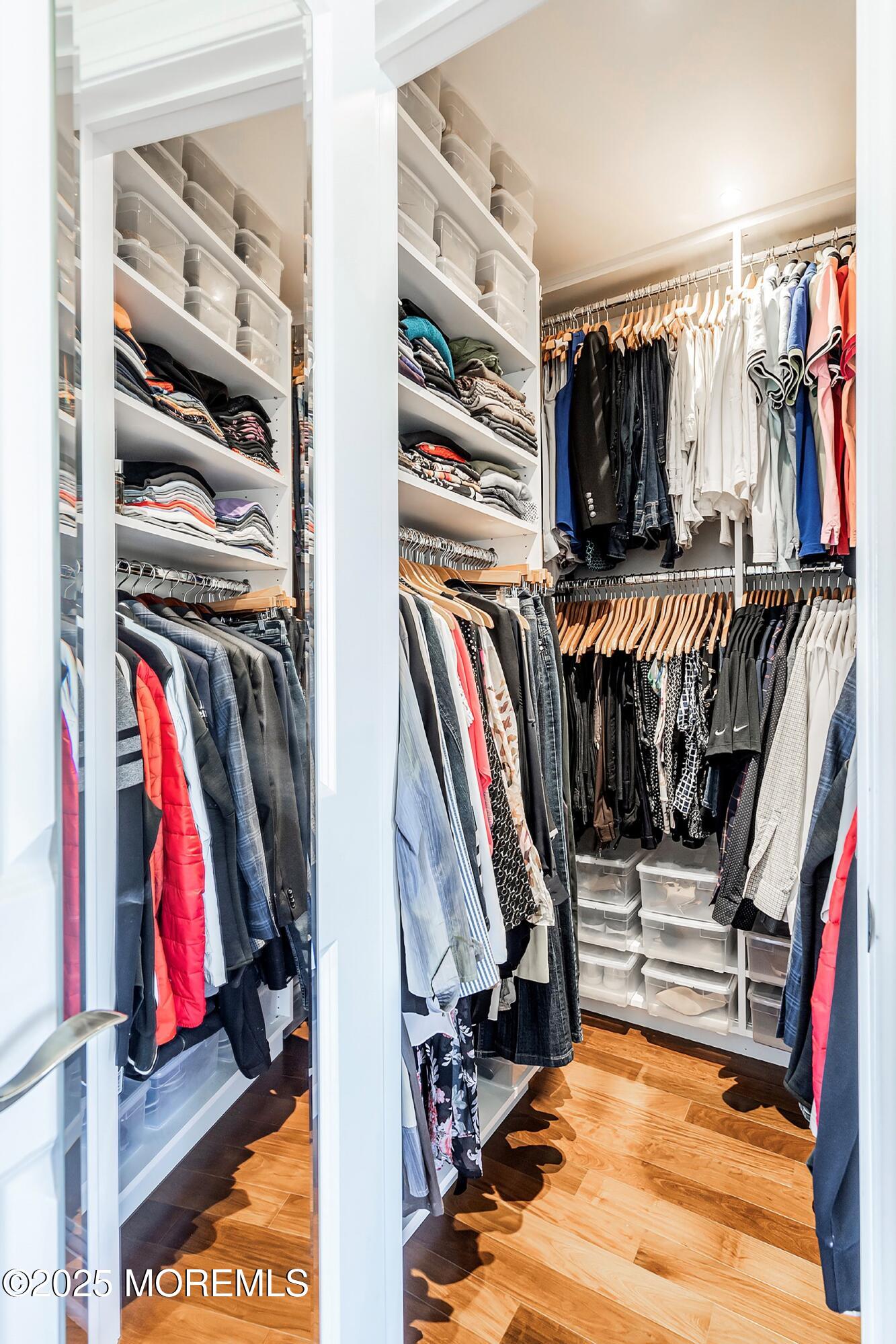 32 Bristel Road, Unit 212 Holmdel, NJ 07733 - Photo 27 of 61 a view of walk in closet with clothes and shoes