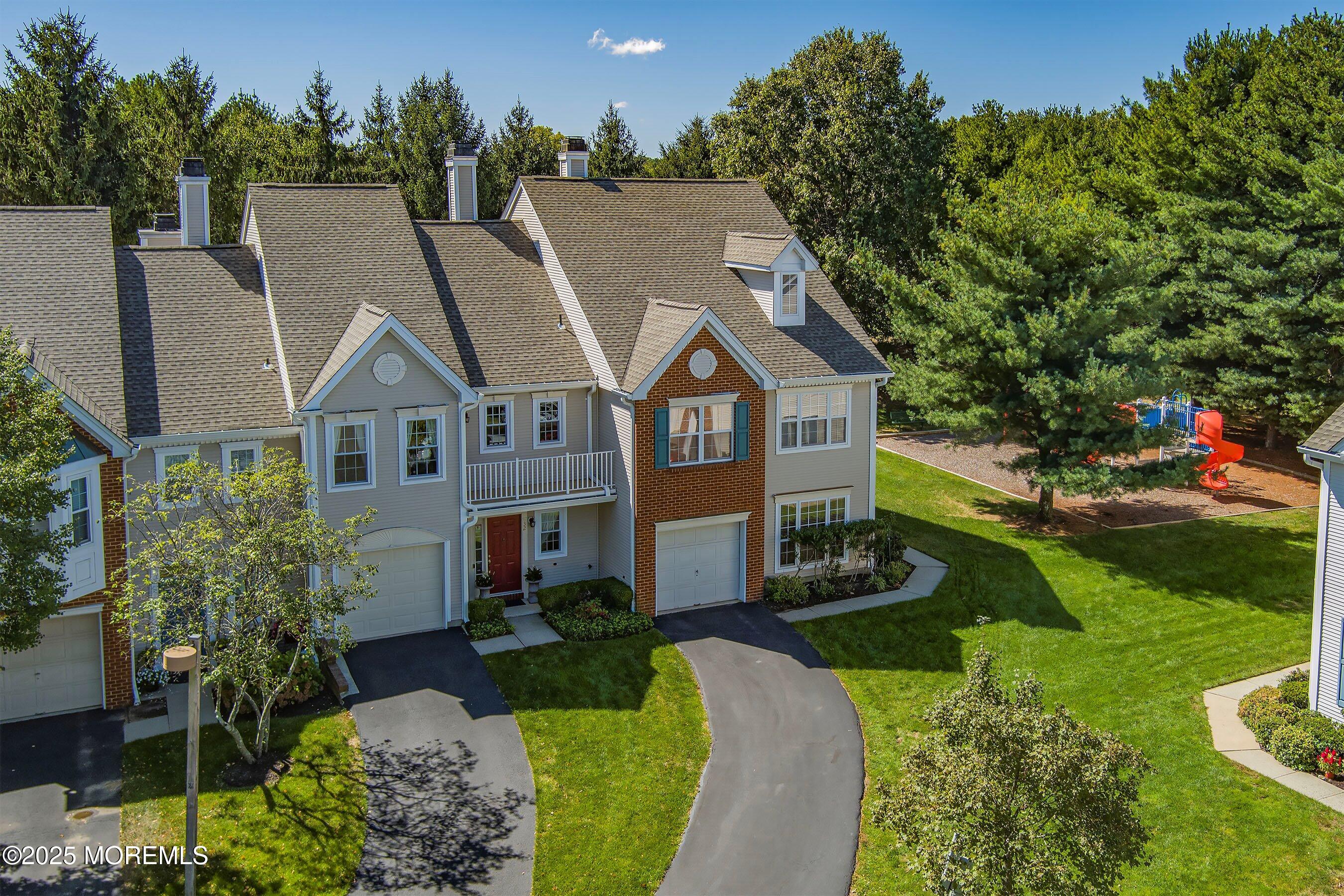 32 Bristel Road, Unit 212 Holmdel, NJ 07733 - Photo 4 of 61 a aerial view of a house with a yard