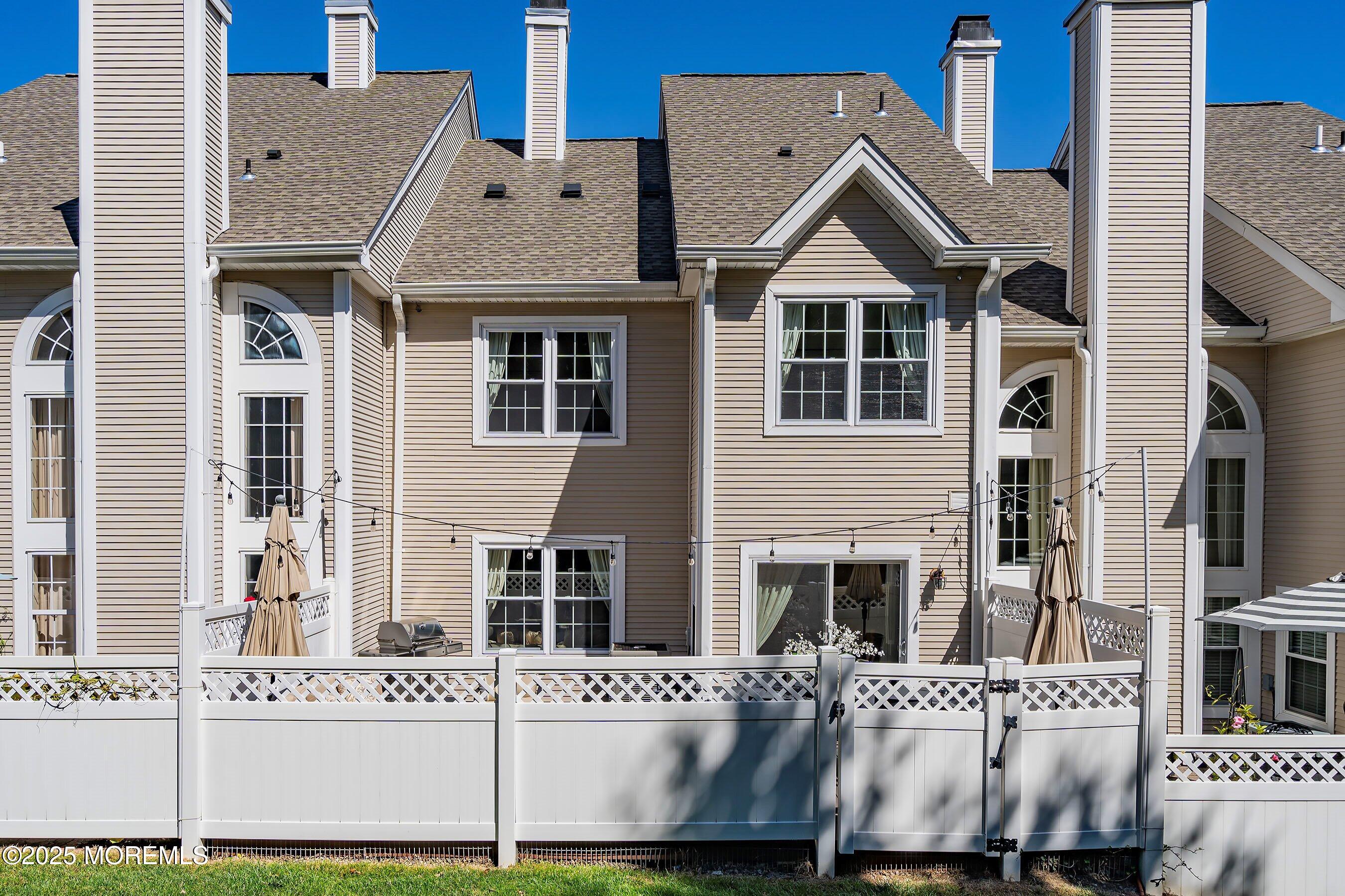 32 Bristel Road, Unit 212 Holmdel, NJ 07733 - Photo 46 of 61 a front view of a building with a yard