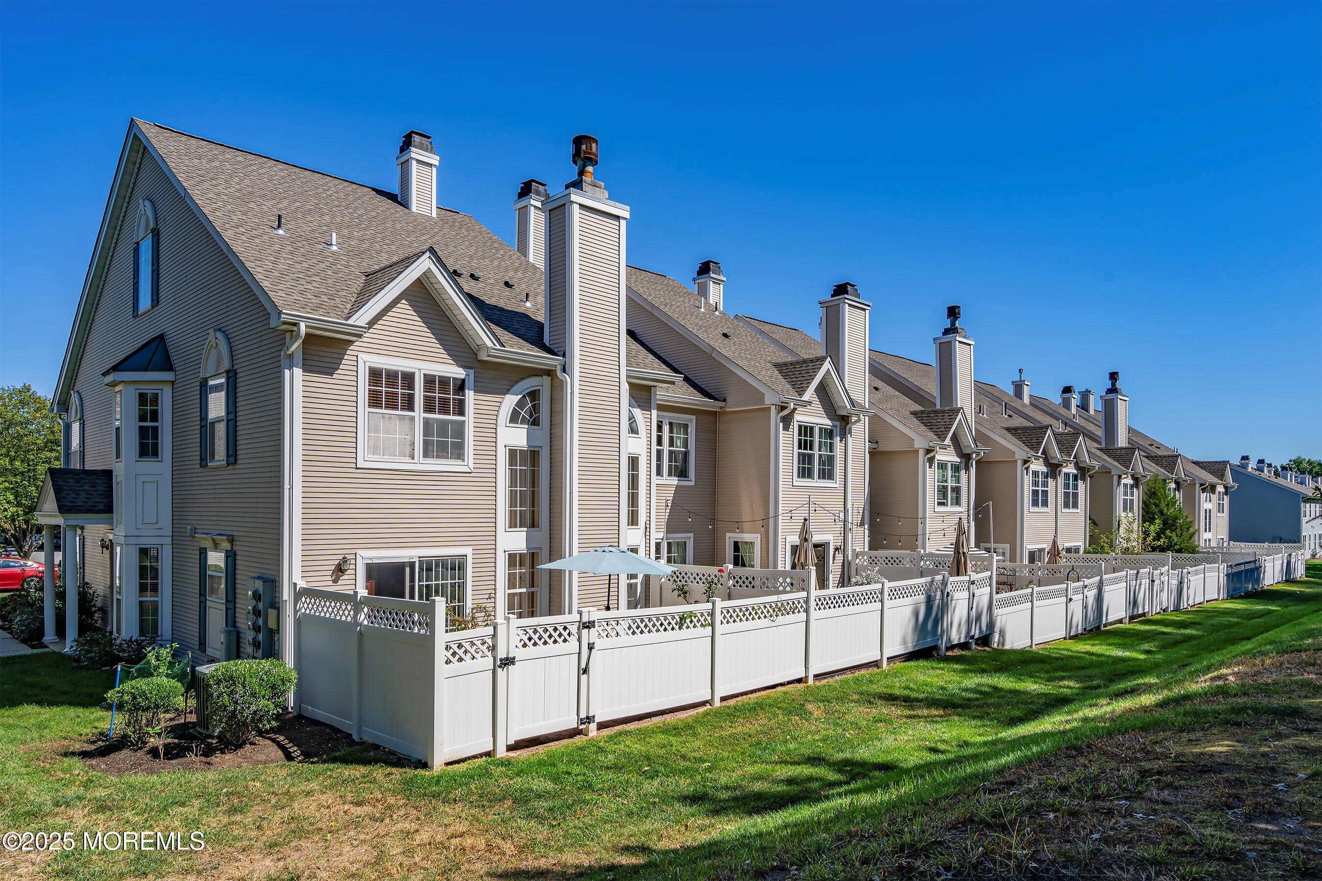32 Bristel Road, Unit 212 Holmdel, NJ 07733 - Photo 47 of 61 a view of a house with backyard and porch